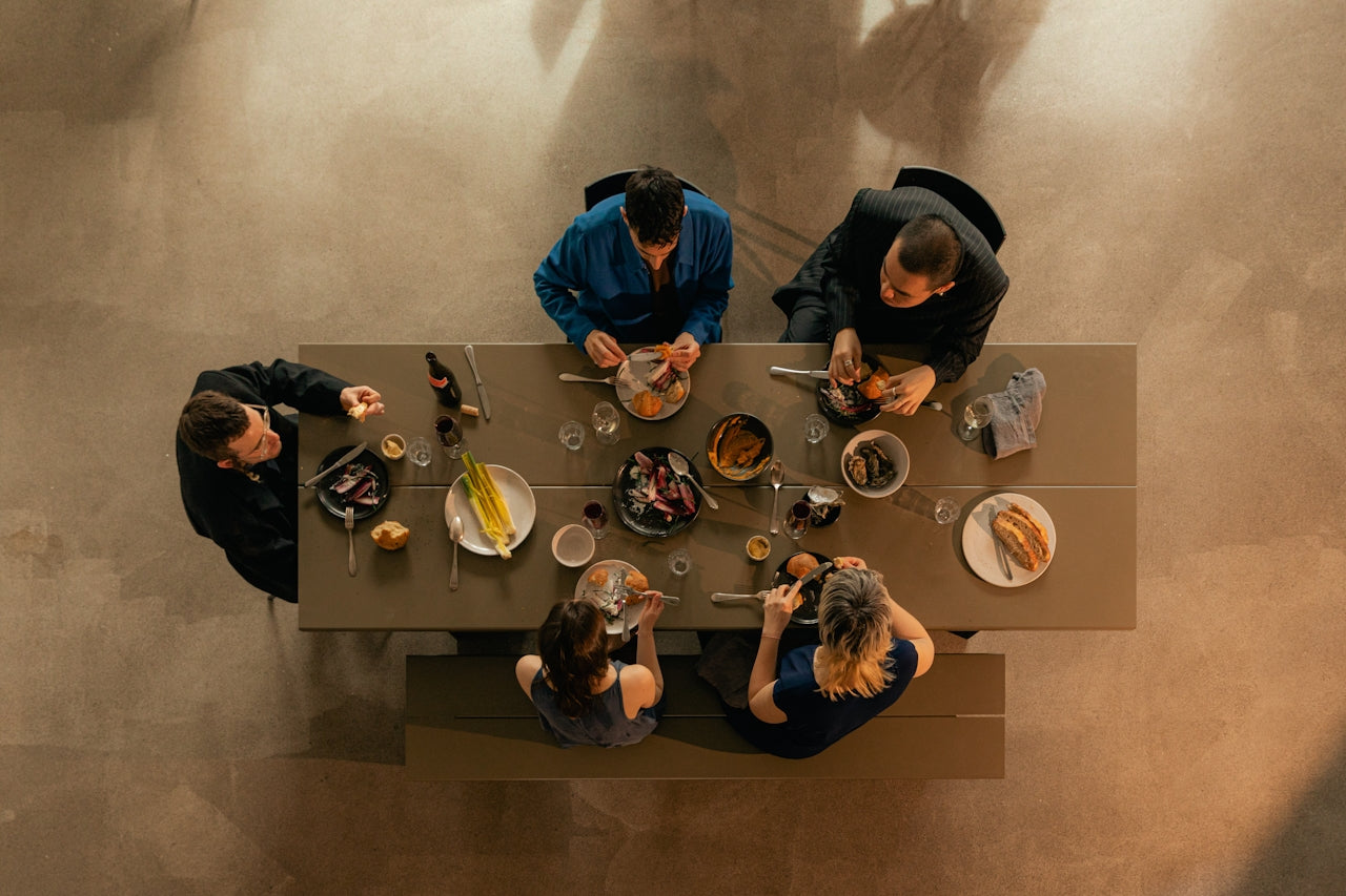 friends gathered at a table having a meal