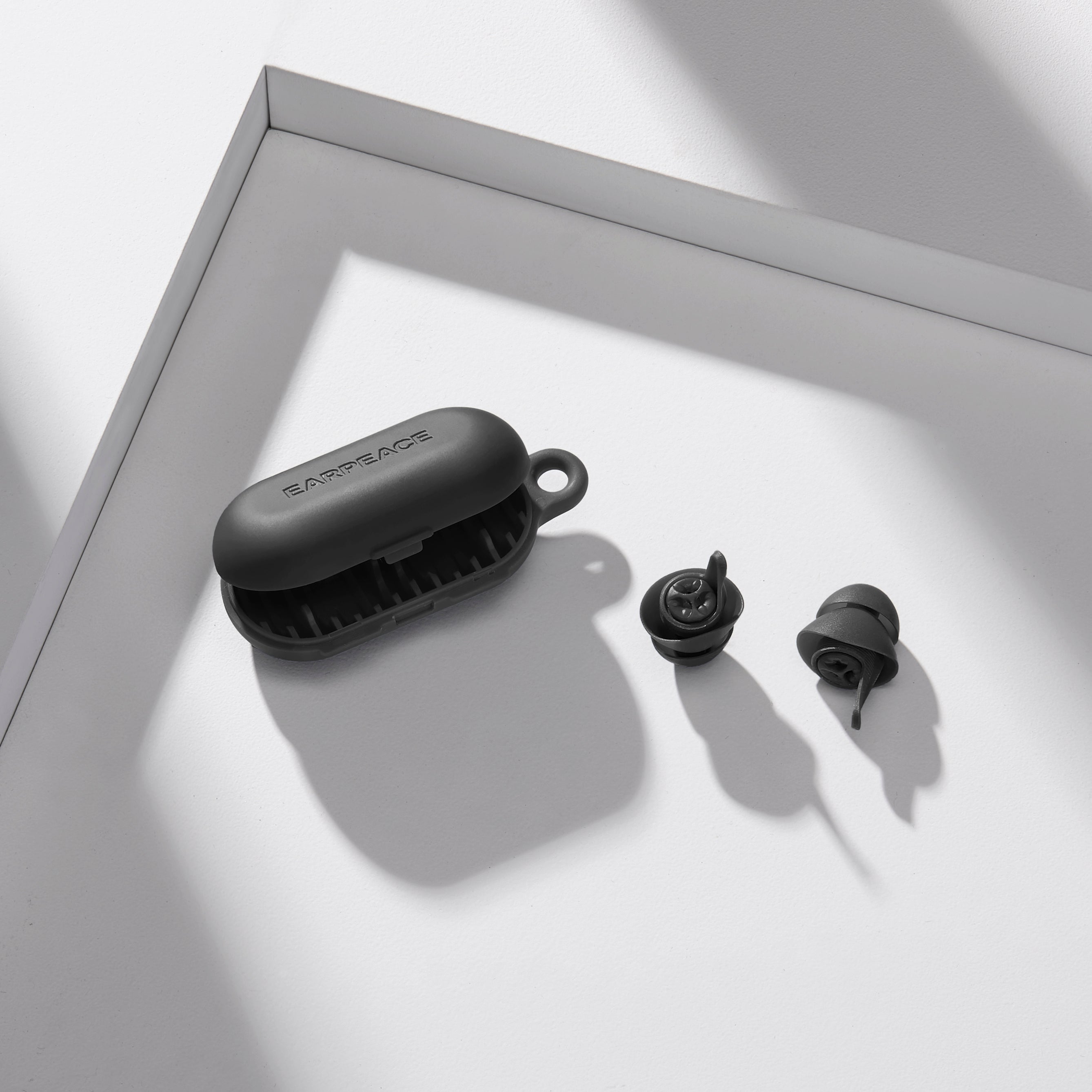 earpeace everyday black case and two black earplugs