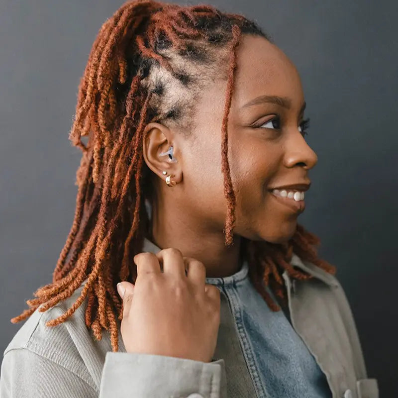 side view of model wearing Sport PRO earplugs