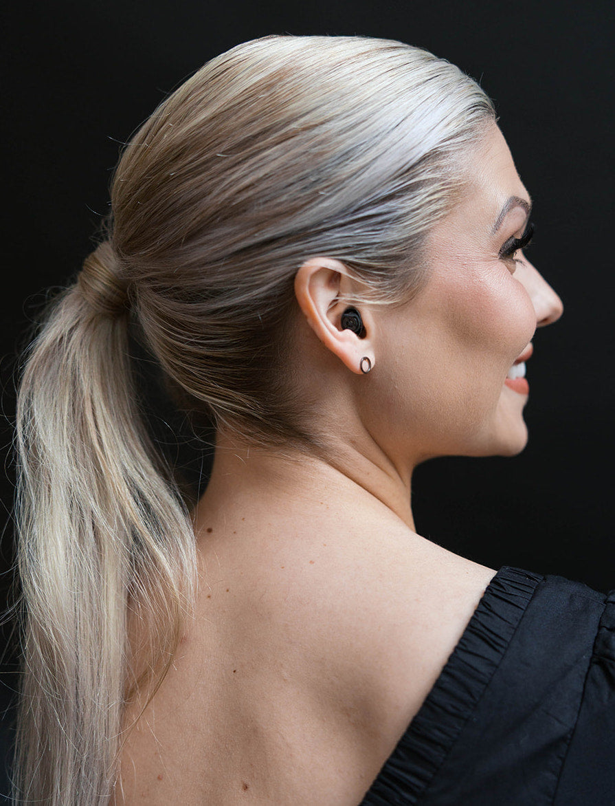 girl wearing earpeace everyday black earplug